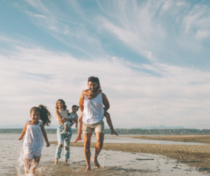 Family walking on the beach together